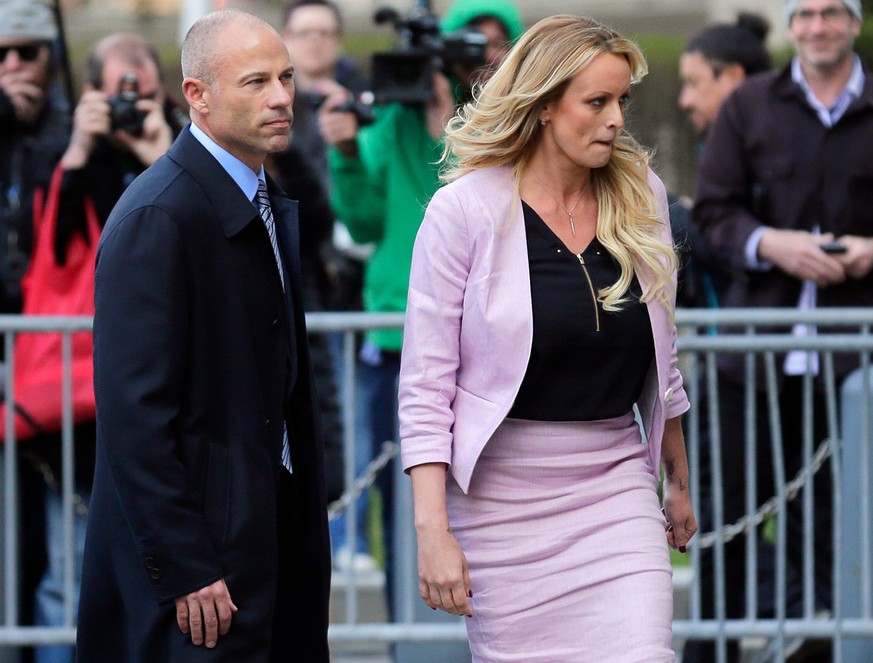 Stormy Daniels and her attorney Michael Avenatti turn from the microphones after speaking as they leave federal court in New York, Monday, April 16, 2018. (AP Photo/Seth Wenig)