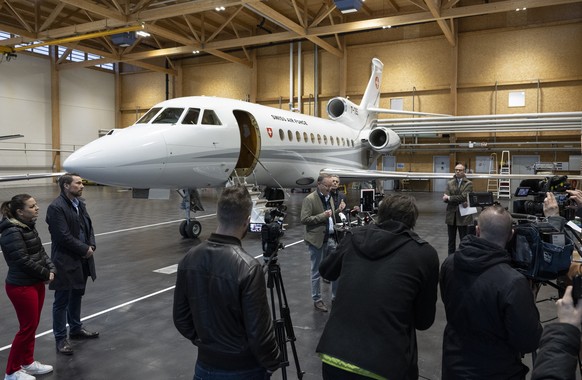 Swiss Federal Councilor Ignazio Cassis, right, and Christian Winter, Swiss Ambassador of Sudan, speak during a press conference at the Bern-Belp Airport in Belp, Switzerland, Tuesday, April 25, 2023.  ...