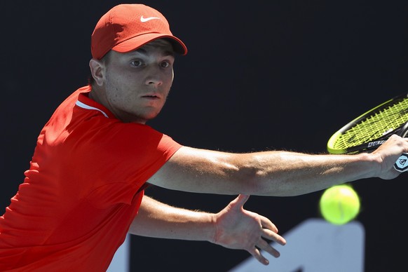 Miomir Kecmanovic of Serbia plays a backhand return to Tommy Paul of the U.S. during their second round match at the Australian Open tennis championships in Melbourne, Australia, Wednesday, Jan. 19, 2 ...