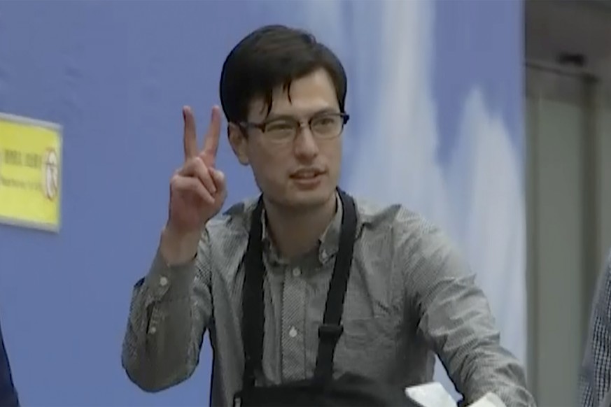 Australian student Alex Sigley gestures as he arrives at the airport in Beijing on Thursday, July 4, 2019. The Australian student who vanished in North Korea more than a week ago arrived in Beijing on ...