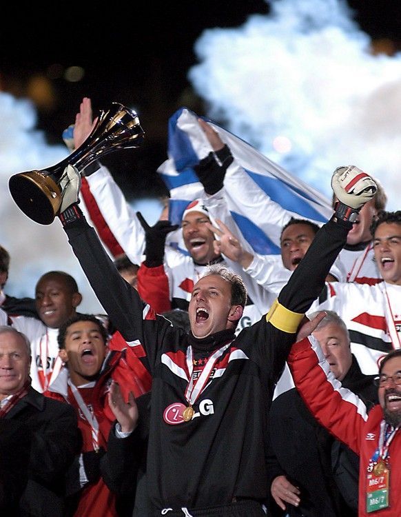 Sao Paolo FC goalkeeper and captain Rogerio Ceni holds up the World Club Championship Toyota Cup following his team&#039;s win against European Champions Liverpool in the final in Yokohama, Japan, Sun ...