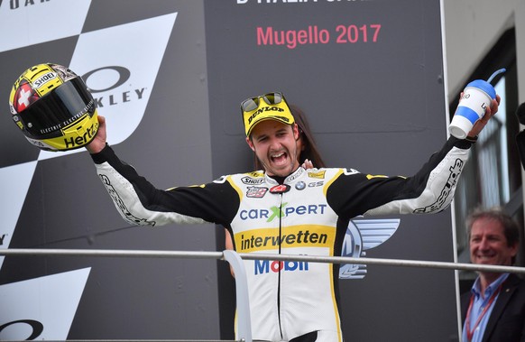 epa06009736 Second placed Swiss Thomas Luethi of Carxeper Interwetten celebrates on the podium of the Moto2 during the Italian Grand Prix at the Mugello circuit in Scarperia, Italy, 04 June 2017. EPA/ ...