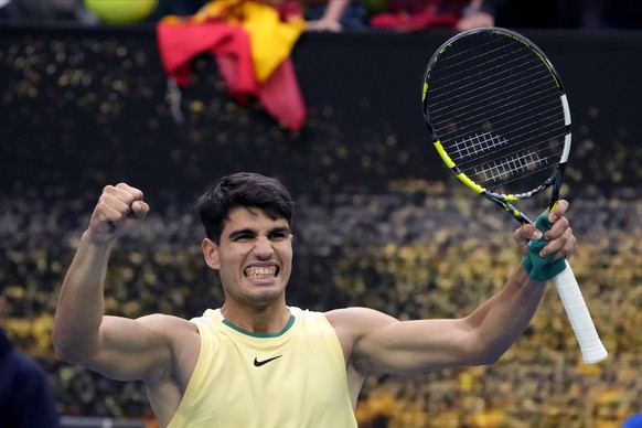 Carlos Alcaraz of Spain celebrates after defeating Lorenzo Sonego of Italy in their second round match at the Australian Open tennis championships at Melbourne Park, Melbourne, Australia, Thursday, Ja ...