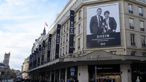 Commercials for Chinese company Shein are seen outside the BHV (Bazar de l&#039;Hotel de Ville) general store ahead of its opening, Tuesday, Nov. 4, 2025 in Paris. (AP Photo/Aurelien Morissard)