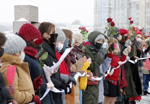 epa09012035 Russian feminists take part in a protest action in support of Russian opposition leader Alexei Navalny and all political prisoners on the occasion of Valentine&#039;s Day in St. Petersburg ...