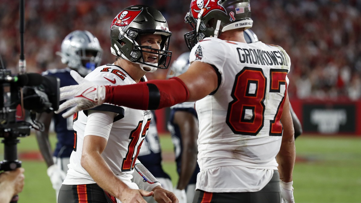 Tampa Bay Buccaneers quarterback Tom Brady (12) celebrates with tight end Rob Gronkowski (87) after Gronkowski caught a 2-yard touchdown pass during the first half of an NFL football game Thursday, Se ...