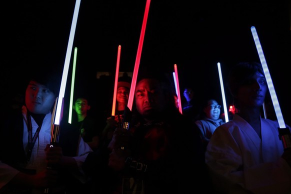 epa05071206 Members of a Star Wars fan club pose for pictures before the film premiere of &#039;Star Wars: The Force Awakens&#039; at Subang Jaya, Selangor, Malaysia, 16 December 2015. The film is the ...