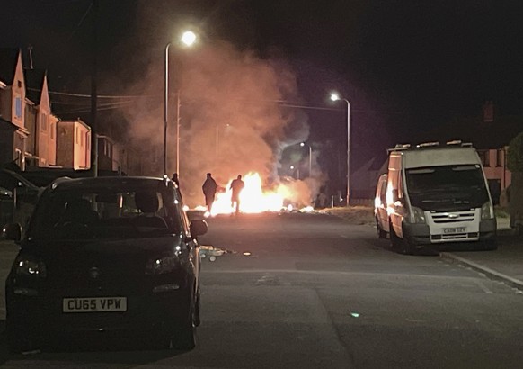 A car burns after being set on fire, on Highmead Road, Ely, in Cardiff, following a serious road traffic accident on Snowden Road in Ely in Cardiff, Tuesday 23rd May 2023. A few cars we...