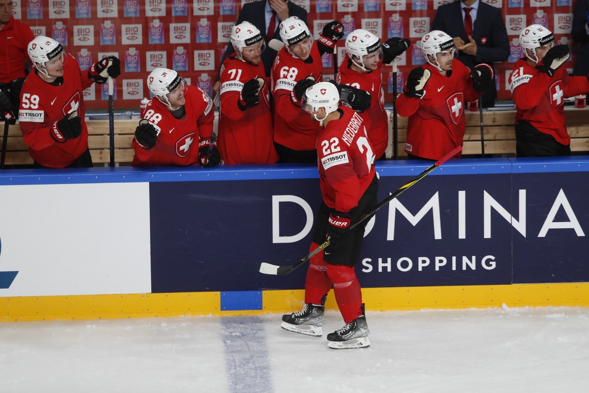 epa10637303 Nino Niederreiter of Switzerland celebrates with his teammates scoring during the preliminary round group B match between Switzerland and Slovakia at the IIHF Ice Hockey World Championship ...