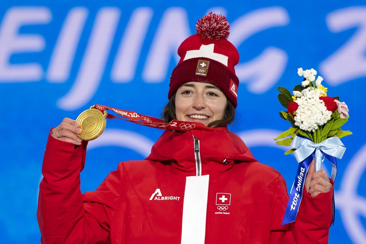 Mathilde Gremaud of Switzerland, gold medal winner in the women's Freestyle Skiing Slopestyle, poses with the medal during the medal ceremony at the 2022 Winter Olympics in Zhangjiakou, China, on ...