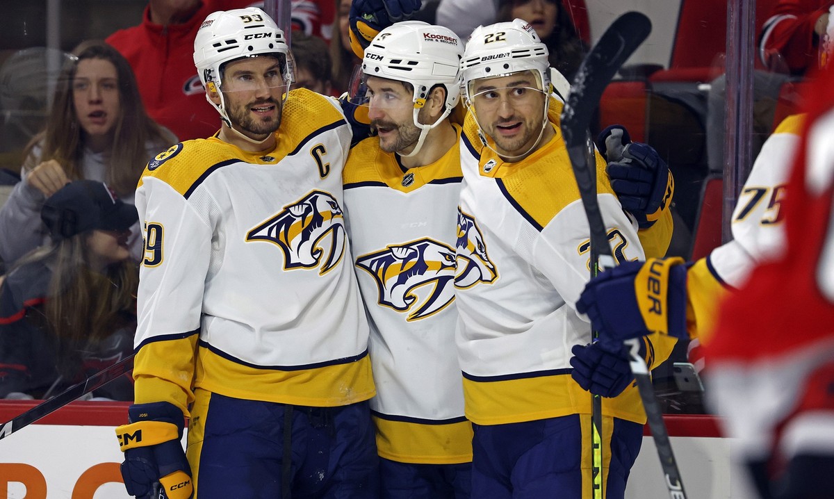Nashville Predators' Filip Forsberg, center, celebrates after his goal with teammates Roman Josi (59) and Nino Niederreiter (22) during the first period of an NHL hockey game against the Carolina ...