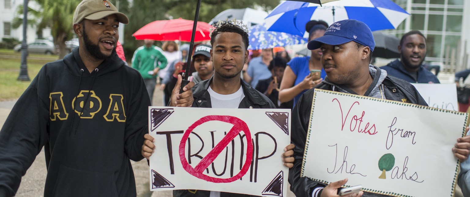 UNITED STATES - NOVEMBER 08: Darren Scioneaux, center, and other Dillard University students march to their polling place on campus to vote in New Orleans, La., November 8, 2016. Caroline Fayard, Demo ...