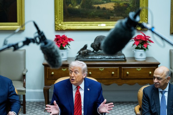 epa12584187 US President Donald J Trump (C) makes remarks in a roundtable with high-tech business executives in the Roosevelt Room of the White House in Washington, DC, USA, 10 December 2025. The Pres ...