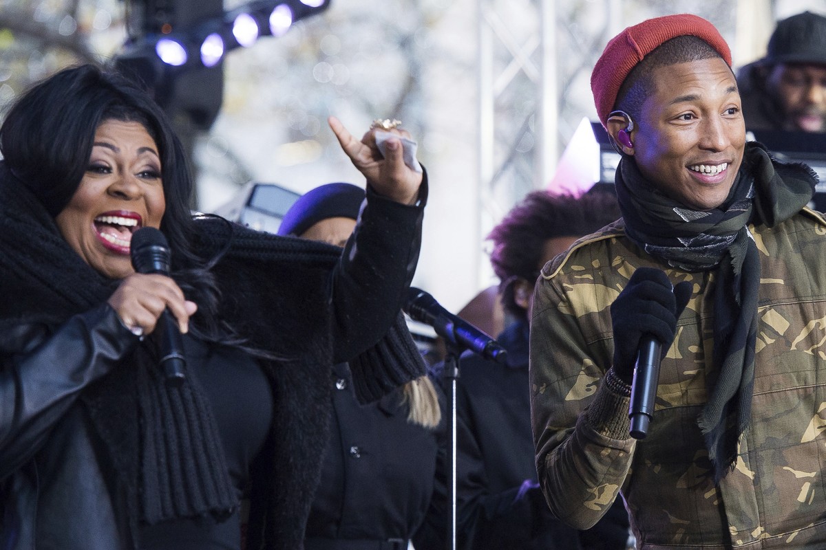 Kim Burrell and Pharrell Williams perform on NBC's "Today" show at Rockefeller Plaza on Friday, Dec. 9, 2016, in New York. (Photo by Charles Sykes/Invision/AP)