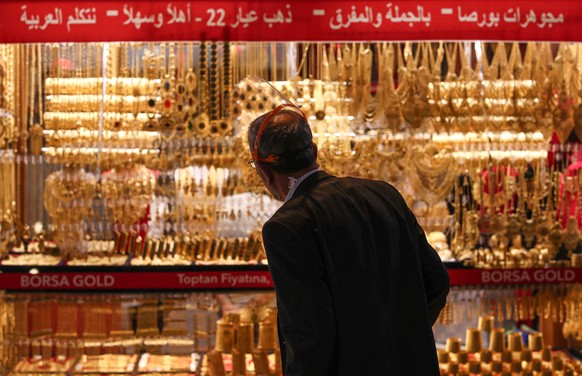 epa08458136 A man wearing protective face mask walks in front of a jeweler at the famous Grand Bazaar in Istanbul, Turkey, 01 June 2020. Turkey re-opens restaurants, cafes, parks, beaches, lifts inter ...