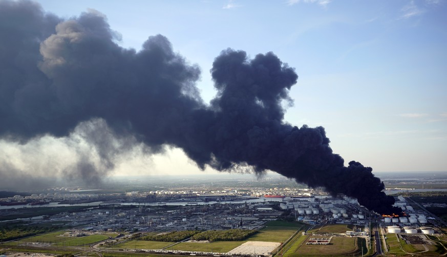 A plume of smoke rises from a petrochemical fire at the Intercontinental Terminals Company Monday, March 18, 2019, in Deer Park, Texas. The large fire at the Houston-area petrochemicals terminal will  ...