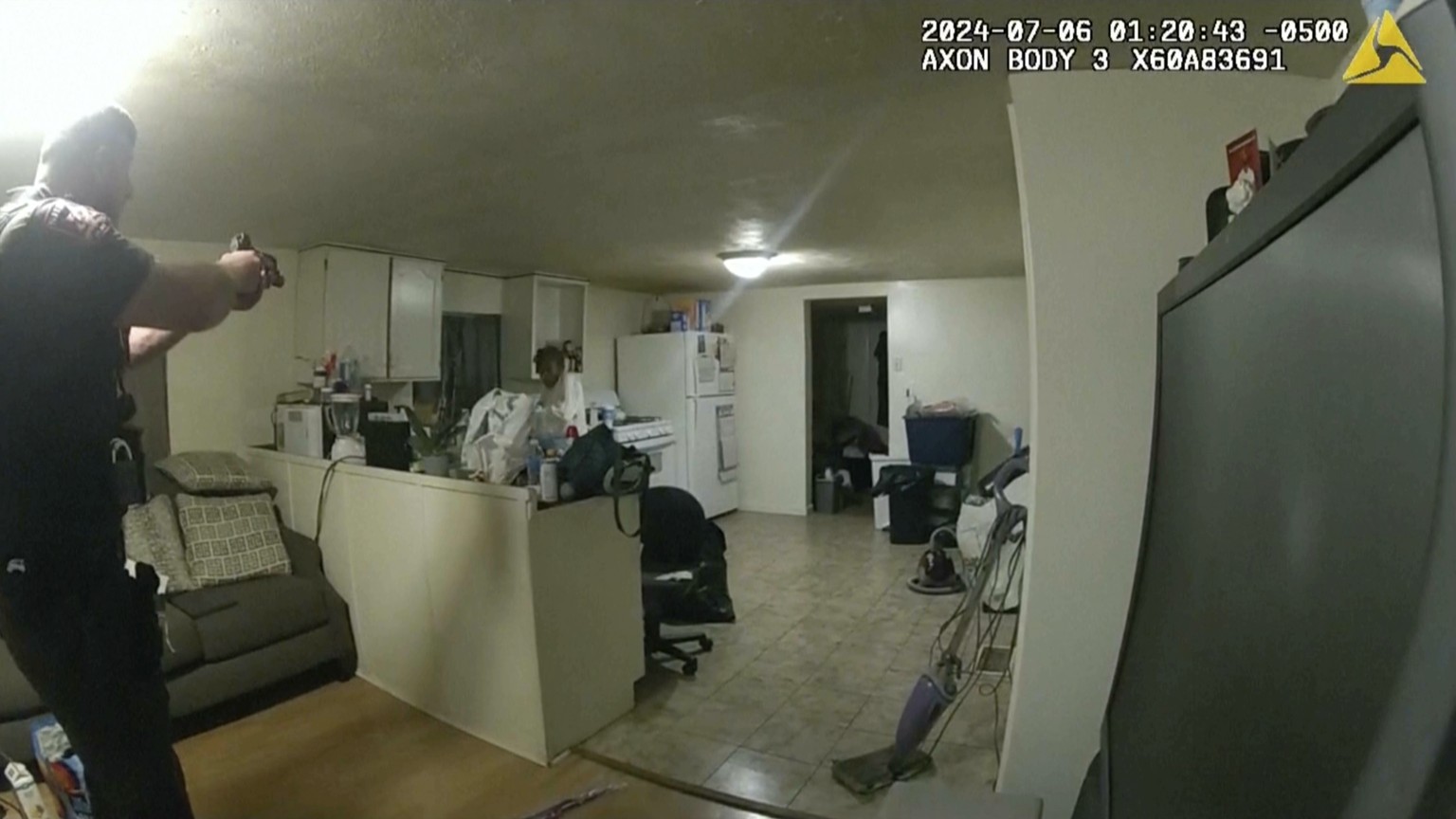 In this image taken from body camera video released by Illinois State Police on Monday, July 22, 2024, former Sangamon County Sheriff?s Deputy Sean Grayson, left, points his gun at Sonya Massey, who c ...