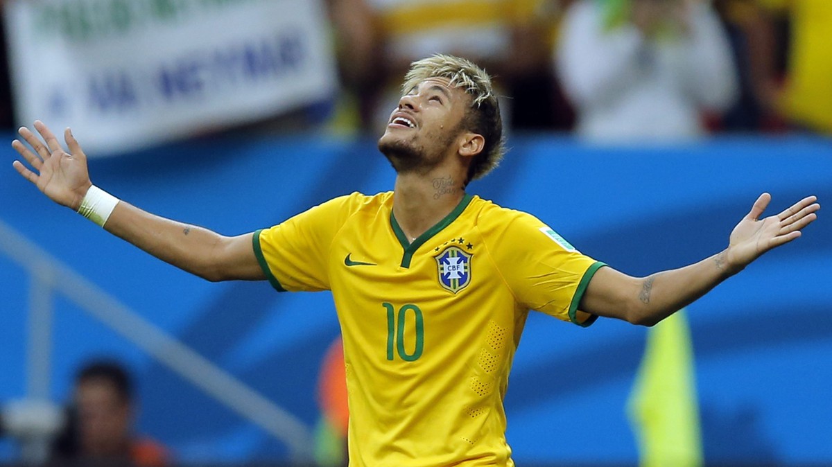 epa04275985 Brazil's Neymar Jr celebrates his 1-2 goal during the FIFA World Cup 2014 group A preliminary round match between Cameroon and Brazil at the Estadio Nacional in Brasilia, Brazil, 23 J ...