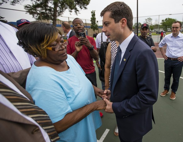 In this Wednesday, June 19, 2019 photo, South Bend Mayor and Democratic presidential candidate Pete Buttigieg shares a moment with Shirley Newbill, mother of Eric Logan, during a gun violence memorial ...