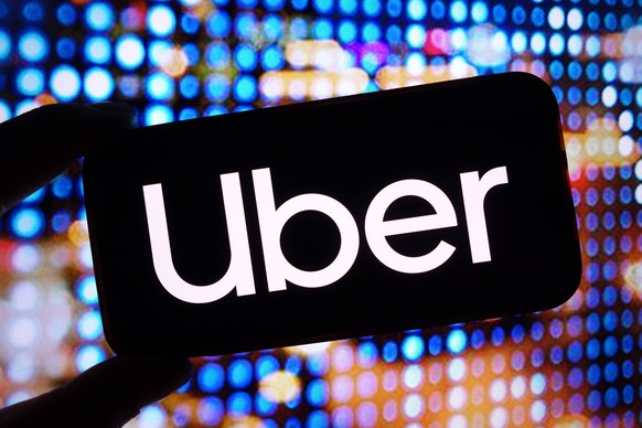 November 20, 2024, Poland: In this photo illustration, the Uber company logo is seen displayed on a smartphone screen. Poland - ZUMAs197 20241120_aab_s197_013 Copyright: xPiotrxSwatx
