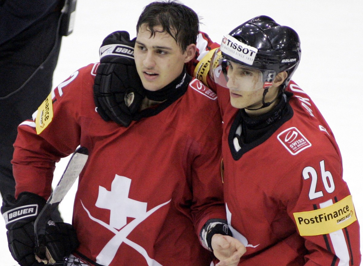 Switzerland's Nino Niederreiter, left, is congratulated by Pascal Marolf on his overtime goal against Russia during a quarterfinal game at the World Junior Hockey championships Saturday, Jan 2, 2 ...