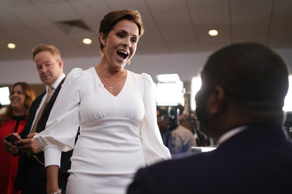 Former Arizona Republican gubernatorial candidate Kari Lake, talks with Rep. Byron Donalds, R-Fla., as they arrive for an evening rally with Republican presidential candidate former President Donald T ...