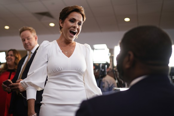 Kari Lake, the former Republican gubernatorial candidate from Arizona, talks to Rep.  Byron Donalds, R-Fla., as they arrive for an evening meeting with Republican presidential candidate, former President Donald T...
