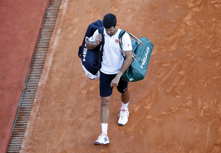 epa05919760 Novak Djokovic of Serbia leaves the court after losing to David Goffin of Belgium after his quarter final match at the Monte-Carlo Rolex Masters tournament in Roquebrune Cap Martin, France ...