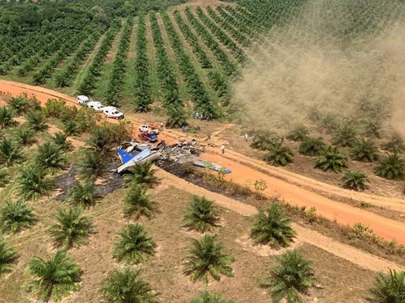 epa07426155 A handout photo made available by the Defensa Civil Colombiana shows the scene of an airplane accident in the village of La Bendicion, municipality of San Martin, Meta, Colombia, 09 March  ...