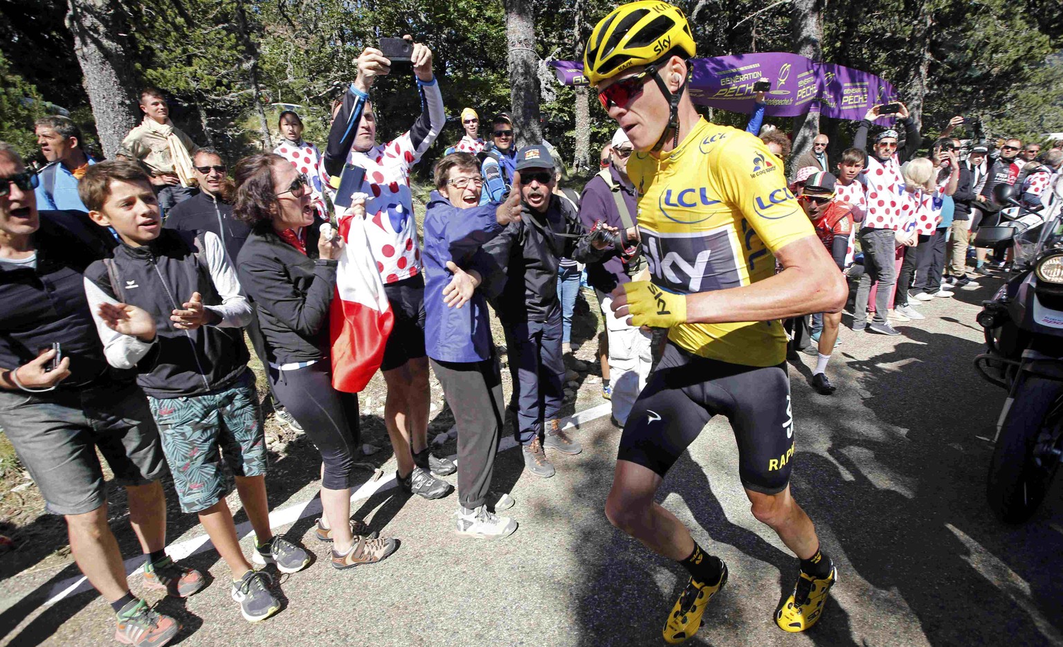 Cycling - The Tour de France cycling race - The 178-km (110.6 miles) Stage 12 from Montpellier to Chalet-Reynard - 14/07/2016 - Yellow jersey leader Team Sky rider Chris Froome of Britain runs on the  ...