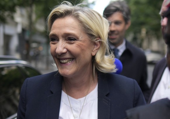 Far-right leader Marine Le Pen arrives at the National Rally party headquarters, Thursday, July 4, 2024 in Paris. The National Rally secured the most votes in the first round of the early legislative  ...