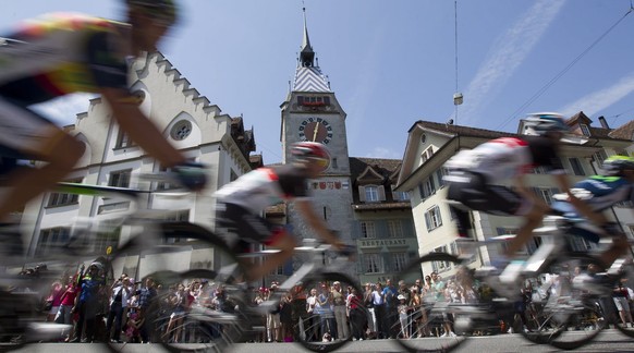 The pack of riders passes the old town of the city of Zug, during the 9th stage, a 216 km race from Naefels-Linttharena to Soerenberg, at the 76th Tour de Suisse cycling race, in Zug, Switzerland, Sun ...