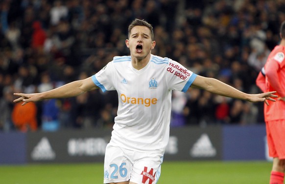 FILE - This is a Sunday, Nov. 5, 2017 file photo of Marseille&#039;s Florian Thauvin as he reacts after scoring his second goal during the League One soccer match between Marseille and Caen, at the Ve ...