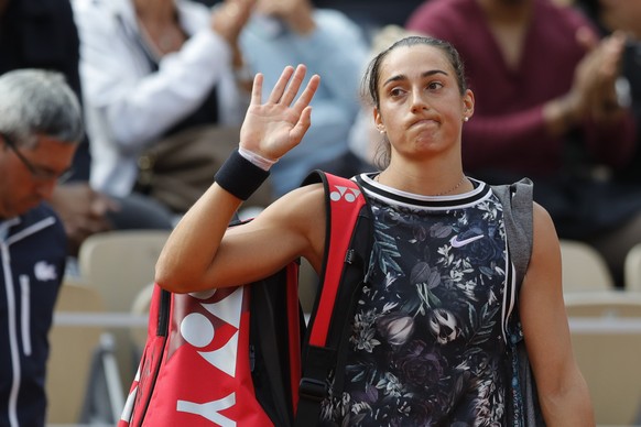 France&#039;s Caroline Garcia waves goodbye after losing her second round match of the French Open tennis tournament against Russia&#039;s Anna Blinkova at the Roland Garros stadium in Paris, Thursday ...