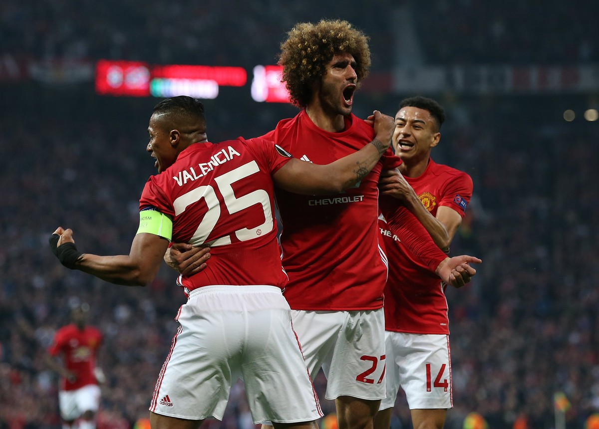 epa05958280 Manchester United's Marouane Fellaini (C) celebrates scoring with Antonio Valencia (L) and Jesse Lingard, during the UEFA Europa League semi final, second leg soccer match between Man ...