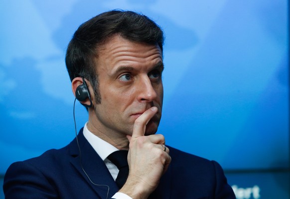 epa09768863 French President Emmanuel Macron looks on as he gives a statement about Covid-19 vaccination during an European Union - African Union summit in Brussels, Belgium, 18 February 2022. EPA/JOH ...