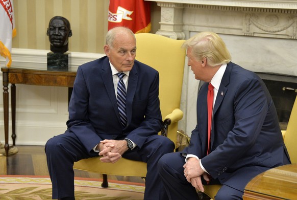 epa06118795 President Donald Trump (R) confers with the new White House Chief of Staff John Kelly after he was sworn in, in the Oval Office of the White House, in Washington, DC., USA, 31 July 2017. K ...