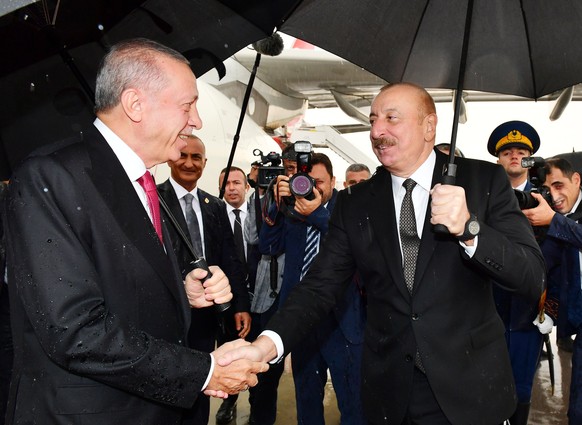 epa10882374 Azerbaijan President Ilham Aliyev (R) welcomes Turkish President Recep Tayyip Erdogan upon his arrival to Nakhchivan Autonomous Republic, Azerbaijan, 25 September 2023. The disarmament pro ...