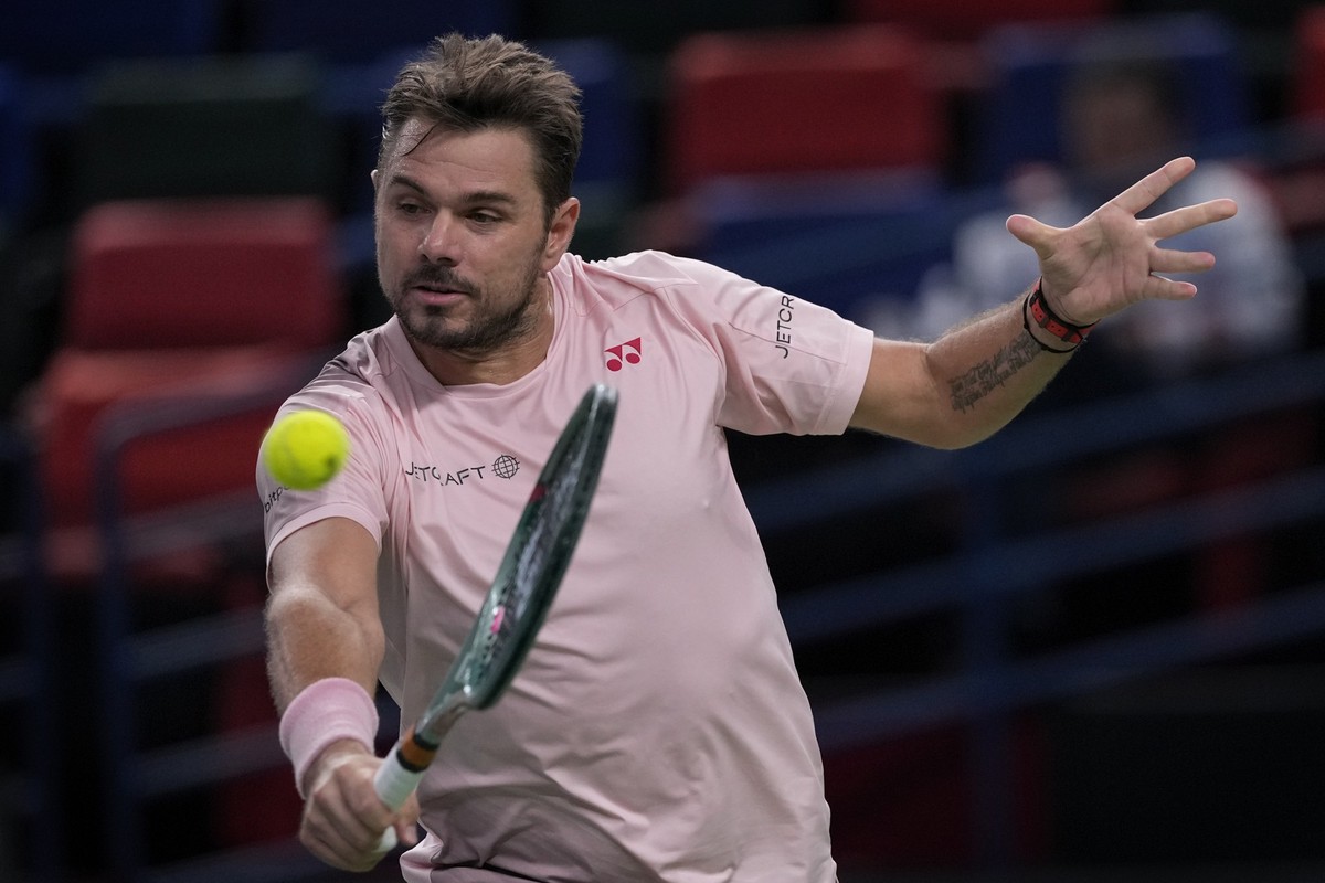 Stan Wawrinka of Switzerland returns a shot to Flavio Cobolli of Italy during the men's singles second round match in the Shanghai Masters tennis tournament at Qizhong Forest Sports City Tennis C ...