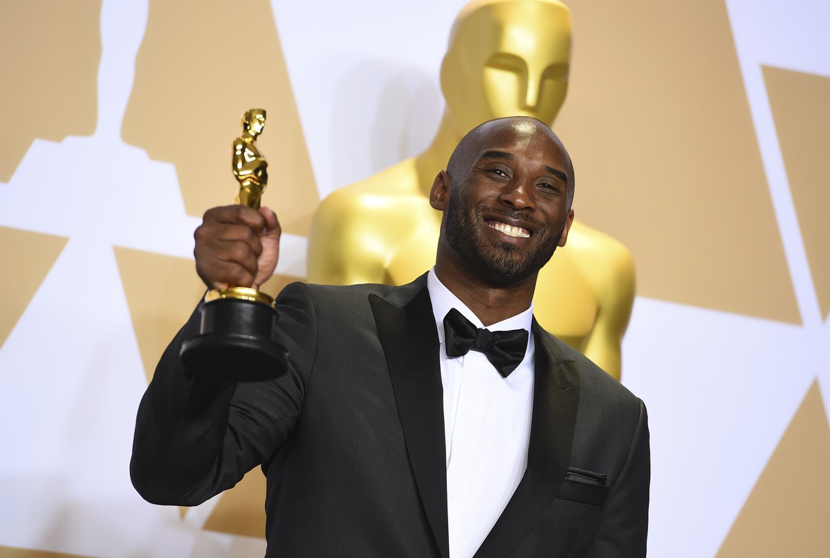 FILE - This March 4, 2018 file photo shows Kobe Bryant, winner of the award for best animated short for "Dear Basketball", at the Oscars in Los Angeles. Bryant, a five-time NBA champion and  ...