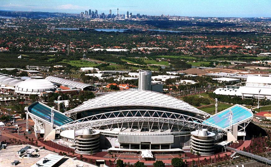 With 144 days to go before the opening ceremony, an up to date view of the Sydney 2000 Olympic Stadium taken Monday April 24, 2000. The Homebush area in center and the city of Sydney in background at  ...