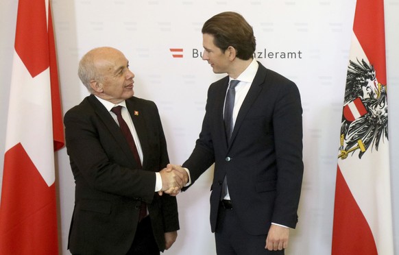 Austrian Chancellor Sebastian Kurz, right, welcomes Swiss Federal President Ueli Maurer, left, for a meeting at the federal chancellery in Vienna, Austria, Friday, Jan. 11, 2019. (AP Photo/Ronald Zak)