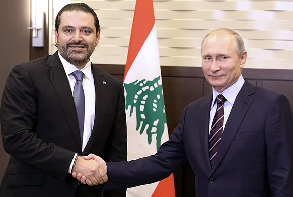 epa06203762 A handout photo made available by Lebanese official photography agency Dalati Nohra shows Russian President Vladimir Putin (R) meeting with Lebanese Prime Minister Saad Hariri (L) in Mosco ...
