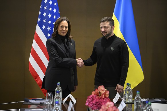 epa11412168 US Vice President Kamala Harris (L) shakes hands with Ukraine&#039;s President Volodymyr Zelensky (R) ahead of a bilateral meeting during the Summit on Peace in Ukraine, in Stansstad near  ...