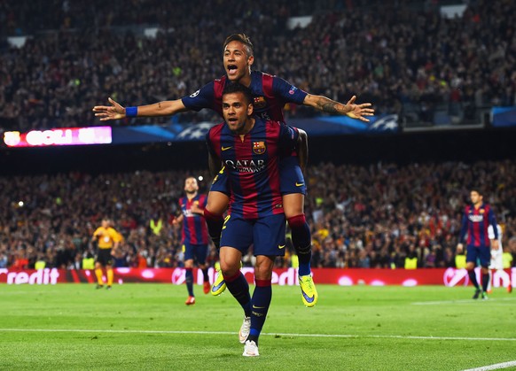 BARCELONA, SPAIN - APRIL 21: Neymar of Barcelona celebrates with Daniel Alves (front) as he scores their second goal during the UEFA Champions League Quarter Final second leg match between FC Barcelon ...