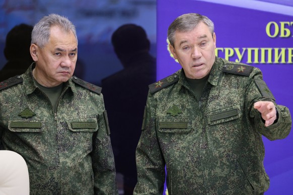 TILE - Russian Defense Minister Sergei Shoigu, left, and Chief of the Russian General Staff Valery Gerasimov attend the meeting with Russian President Vladimir Putin during his visit to the Joint Staff...