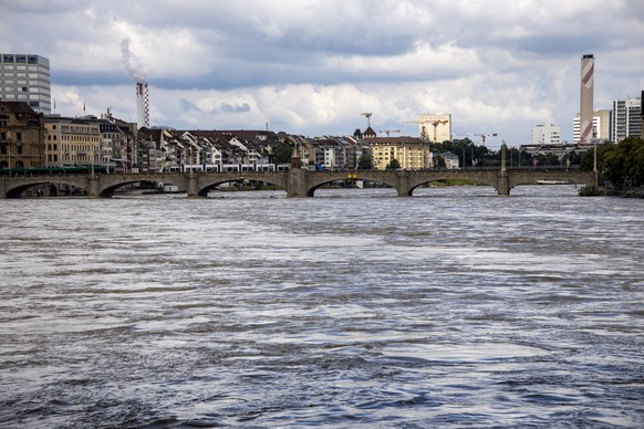 epa09348546 A view of the Middle Bridge over the Rhein (Rhine River) in Basel, Switzerland, 16 July 2021. The high water mark was exceeded on the Rhine near Basel days ago and shipping traffic had to  ...