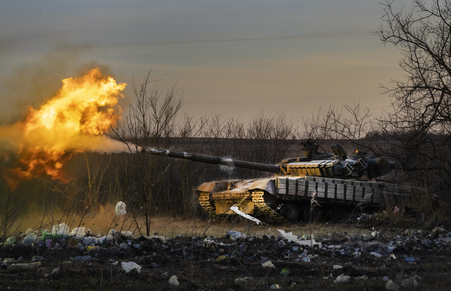 FILE - A Ukrainian tank of the 17th Tank Brigade fires at Russian positions in Chasiv Yar, the site of fierce battles with the Russian troops in the Donetsk region, Ukraine, Thursday, Feb. 29, 2024. ( ...