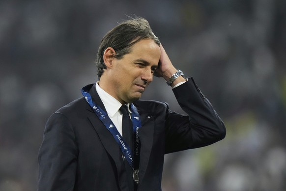 Inter Milan&#039;s head coach Simone Inzaghi walks away with his second place medal at the end of the Champions League final soccer match between Paris Saint-Germain and Inter Milan at the Allianz Are ...