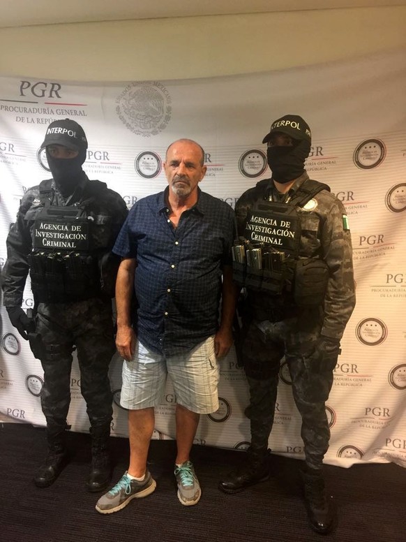 epa05841520 A handout photo made available by the Mexican General Prosecutor&#039;s Office (PGR) shows the arrest of Italian mafia member Giulio Perrone, in Mexico City 10 March 2017. According to Mex ...